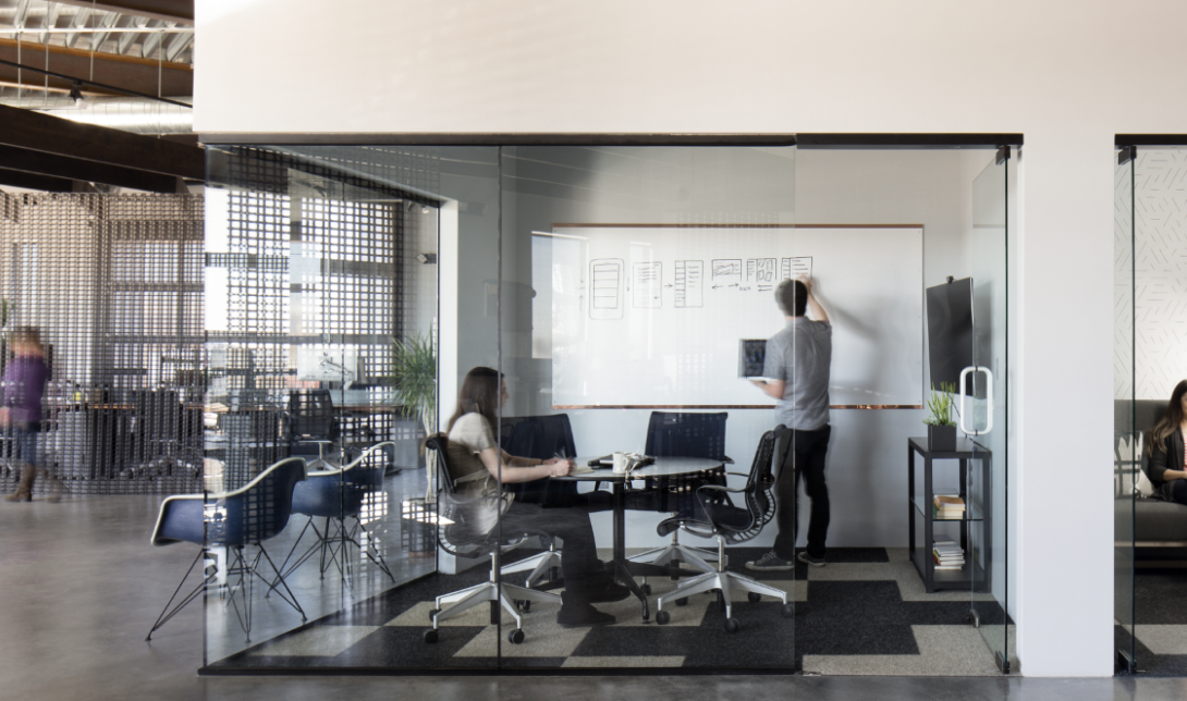 Two People Meeting In A Confrence Room